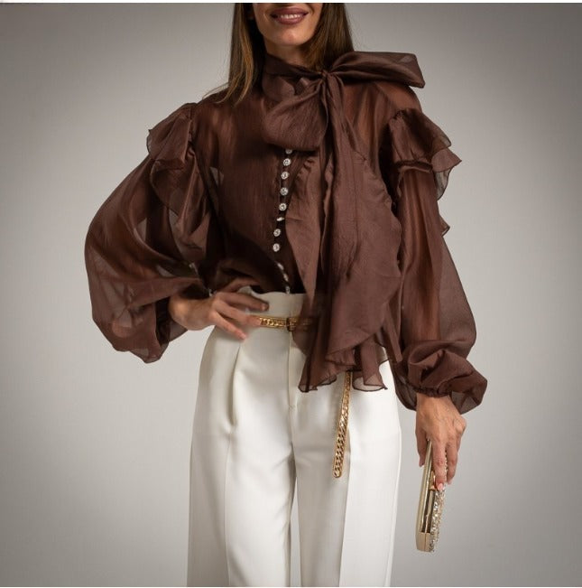 Blusa marron chocolate vaporosa transparente con volantes