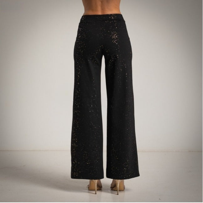 Pantalon tipo leggin pernera ancha con brillo Moda50