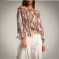 Blusa estampada escote bardot beige