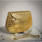 Bolso Rigido Dorado con dibujos grabados