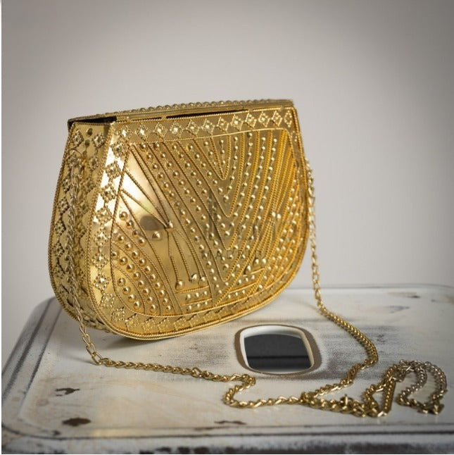 Bolso Rigido Dorado con dibujos grabados