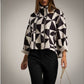 Chaqueta estampado geomtrico blanco y negro doble cremallera y cuello chimenea