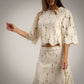Conjunto de encaje de blusa y falda crudo