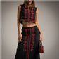 Conjunto de falda y chaleco de lino bordado en negro Moda50