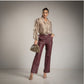 Pantalon ecopiel con cinturon corte recto burgundy