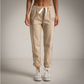 Pantalon sport color beige escudo con cristales de Swarovski Moda50