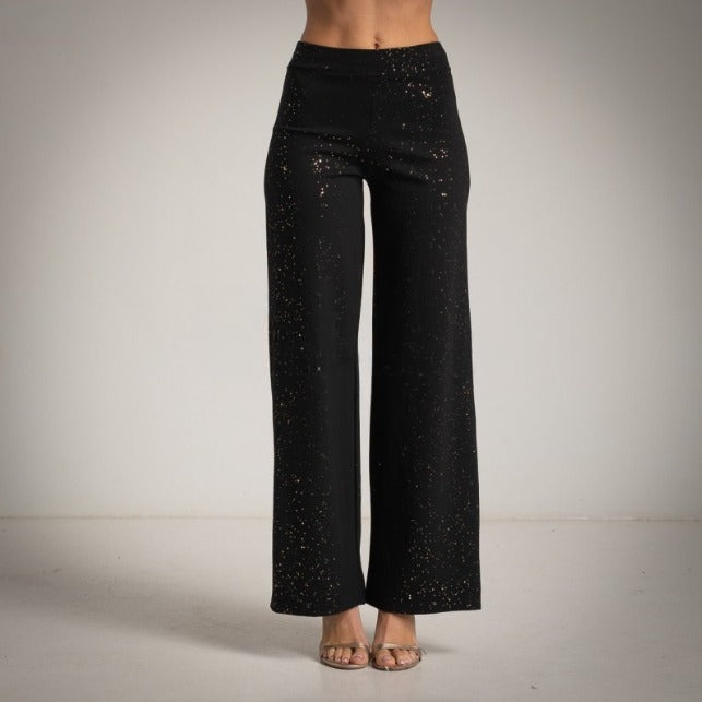 Pantalon tipo leggin pernera ancha con brillo