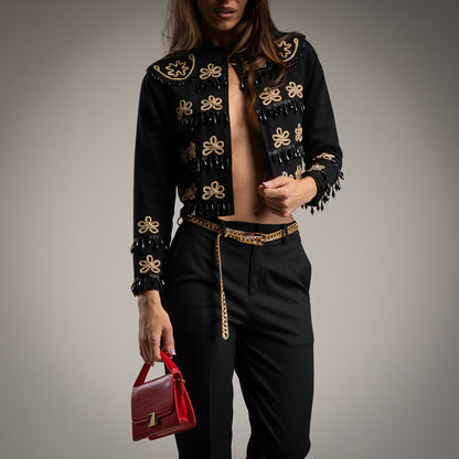 Torera Negra con bordados dorados y apliques negros