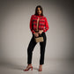 Torera Roja con bordados dorados y apliques negros