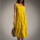 Vestido amarillo al bies con volantes