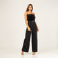 Mono de fiesta negro pantalon palazzio cuerpo de plumas y cinturon con perlas
